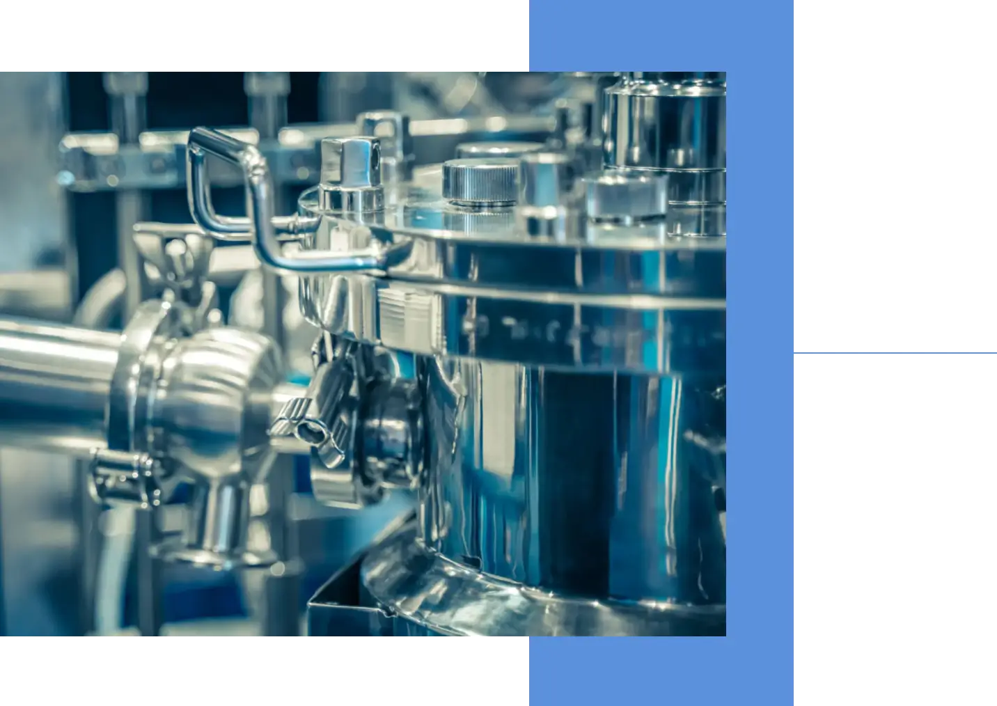 Close-up of shiny stainless steel industrial machinery parts.